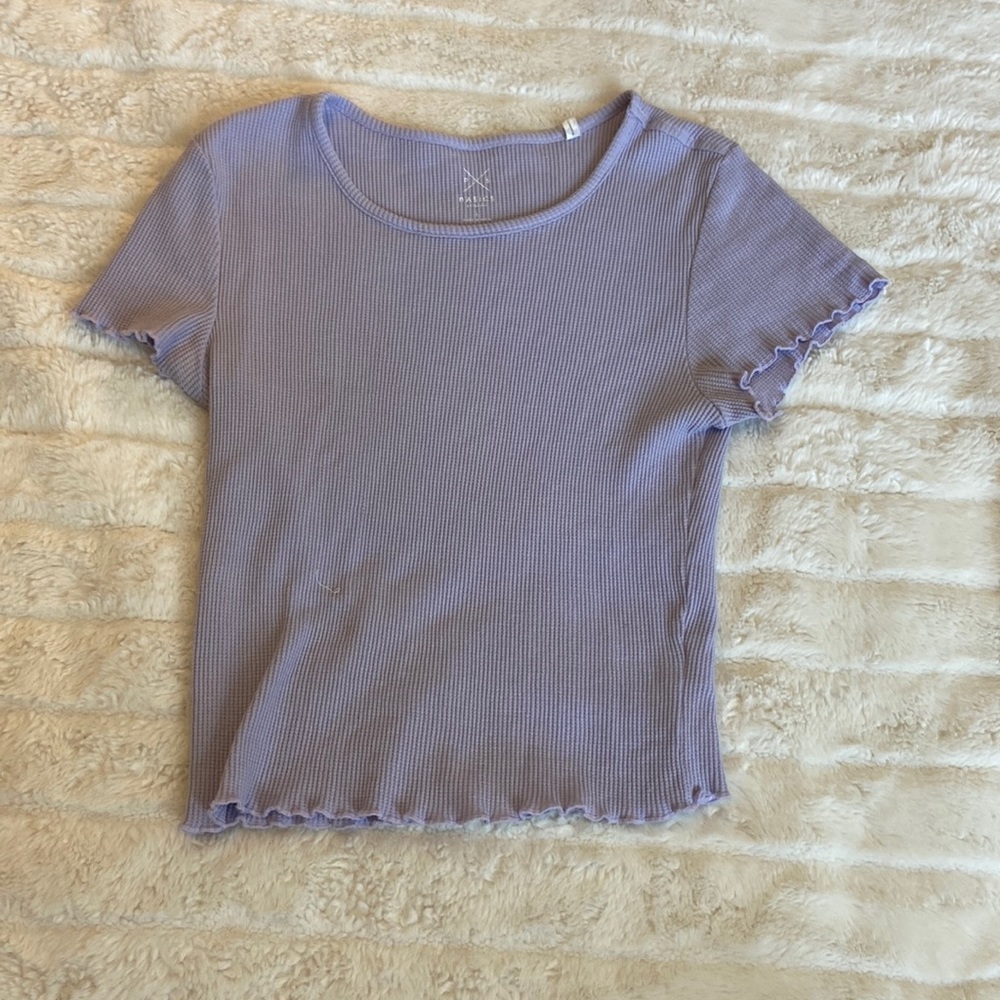 This cute purple crop top is from PAC Sun !